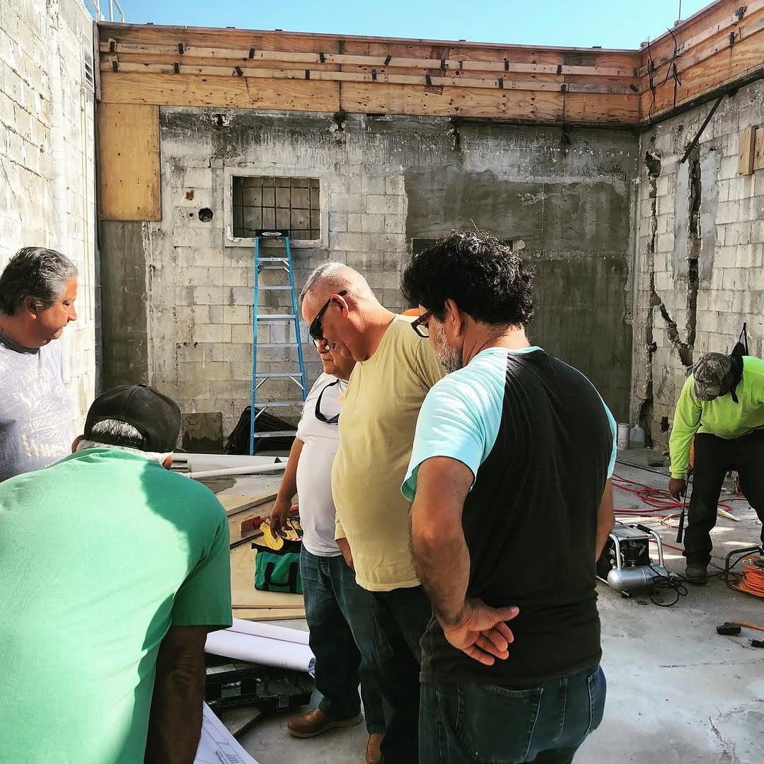 Project team reviewing plans on site